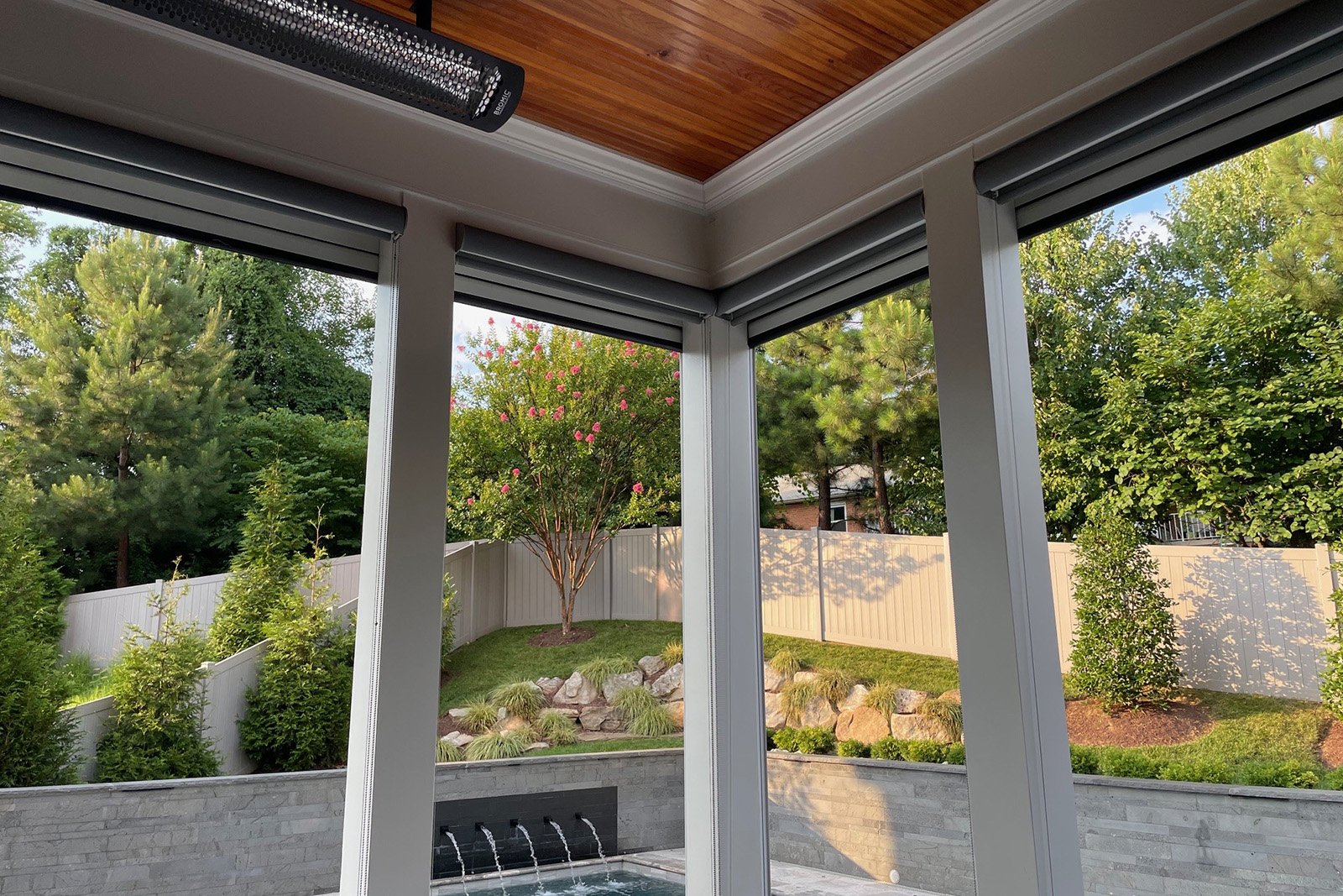 Retractable shades infrared heaters on a Fall Church, VA patio space allow for year-round enjoyment.